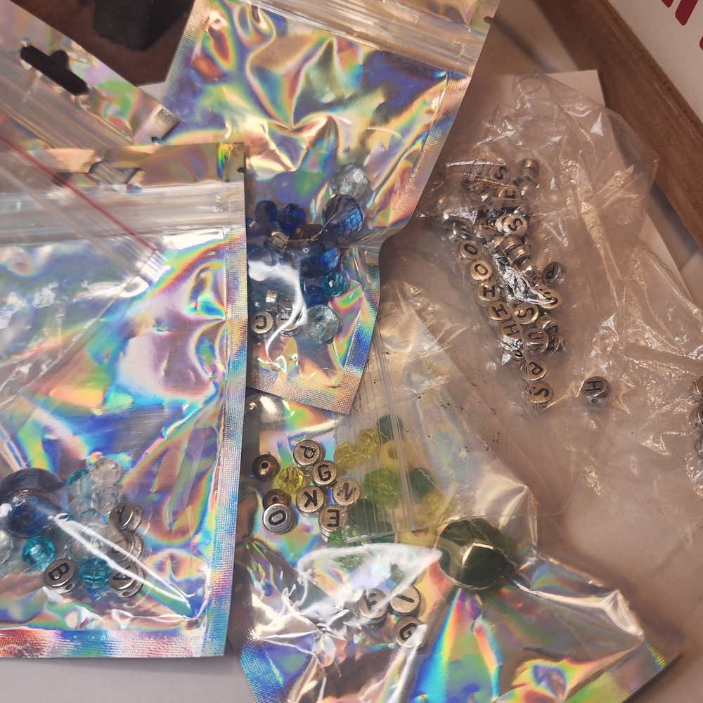 Colorful Beads and Letters In Metalic Bags